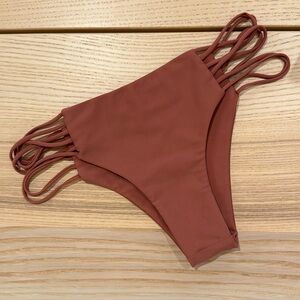 Kapalua multi skinny side string bottom. Mikoh swimwear. Color lychee. Like new